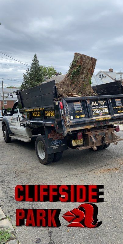 a dump truck is parked on the side of the road .