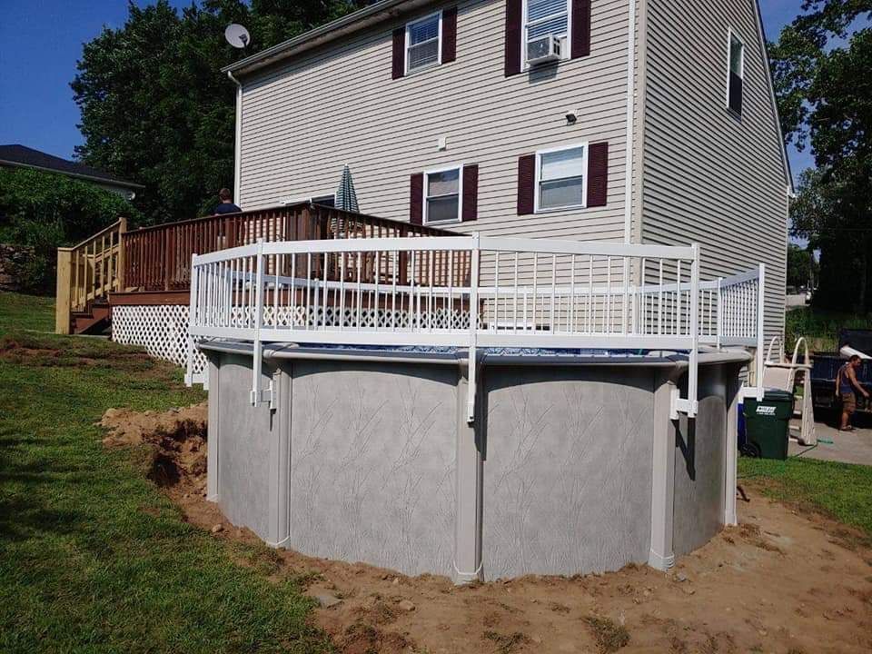 A house with a swimming pool in front of it