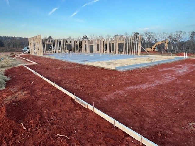 A house being built on a dirt lot