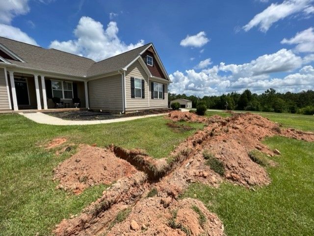 a house with a lot of dirt in front of it