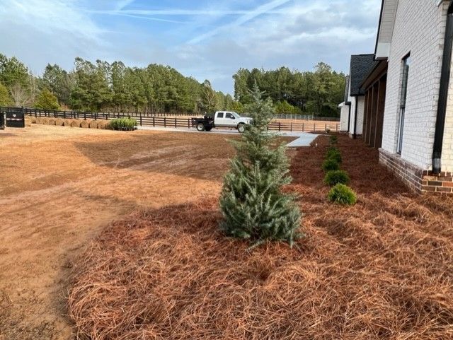 a white truck is parked in the driveway of a house