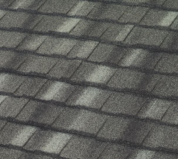 A close up of a roof with a lot of shingles