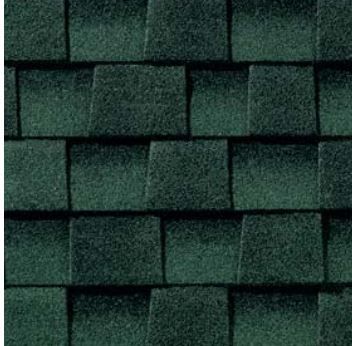 A close up of a row of green shingles on a roof.