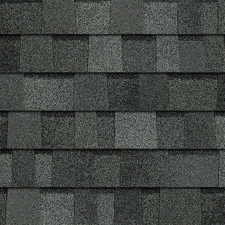 A close up of a roof with shingles on it.