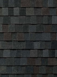 A close up of a roof made of black tiles.
