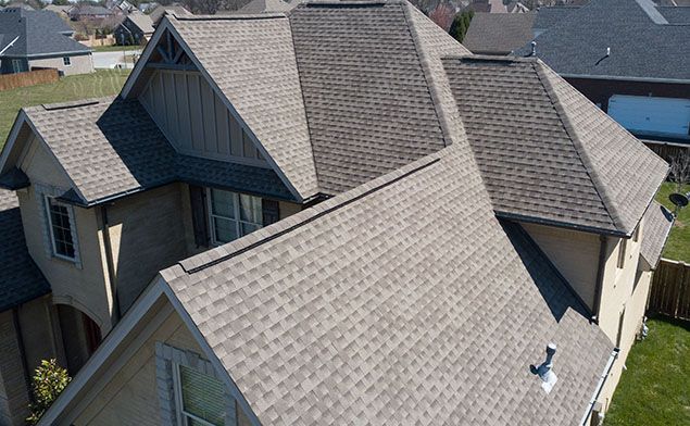 An aerial view of a house with a new roof