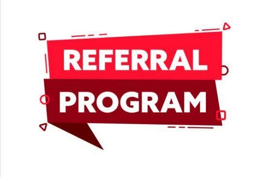 A red sign that says referral program on it.