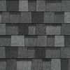 A close up of a row of gray shingles on a roof.