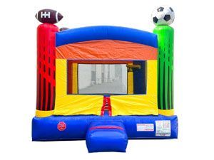 A colorful bouncy house with a football and soccer ball on top