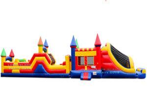 A large colorful bouncy house with a slide and a slide.