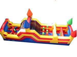 A large inflatable obstacle course with a castle on top of it
