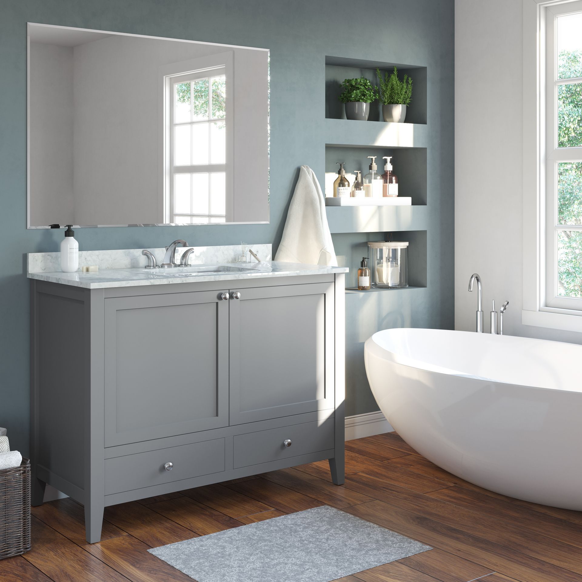 Modern gray bathroom with vanity, mirror, shelves, and a freestanding white tub by a window