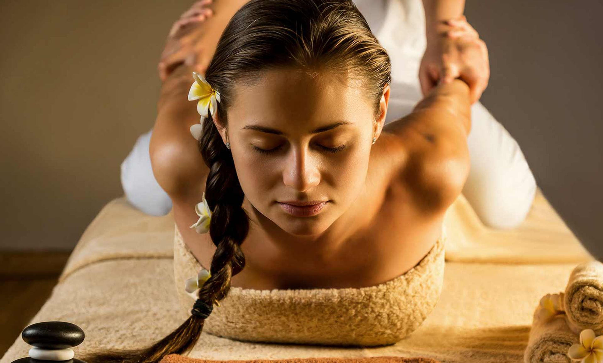 A woman is getting a massage at a spa.