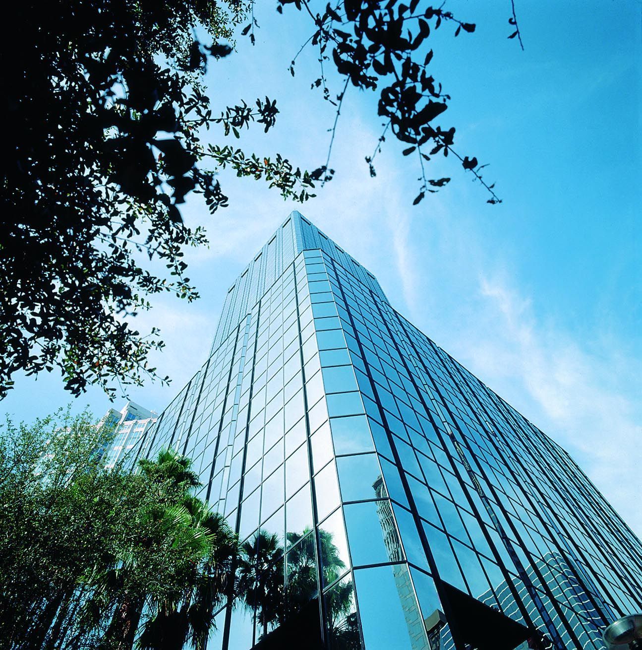 A commercial building with a blue sky in the background
