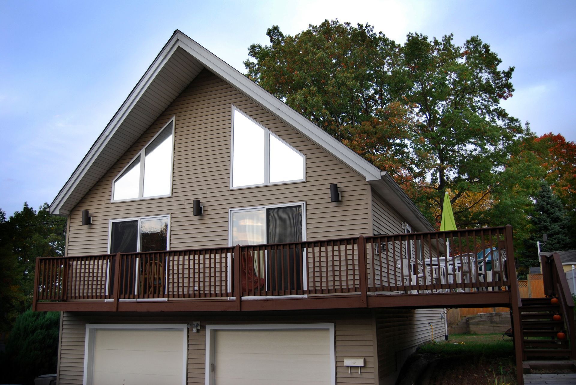 A house with a large deck and a large window