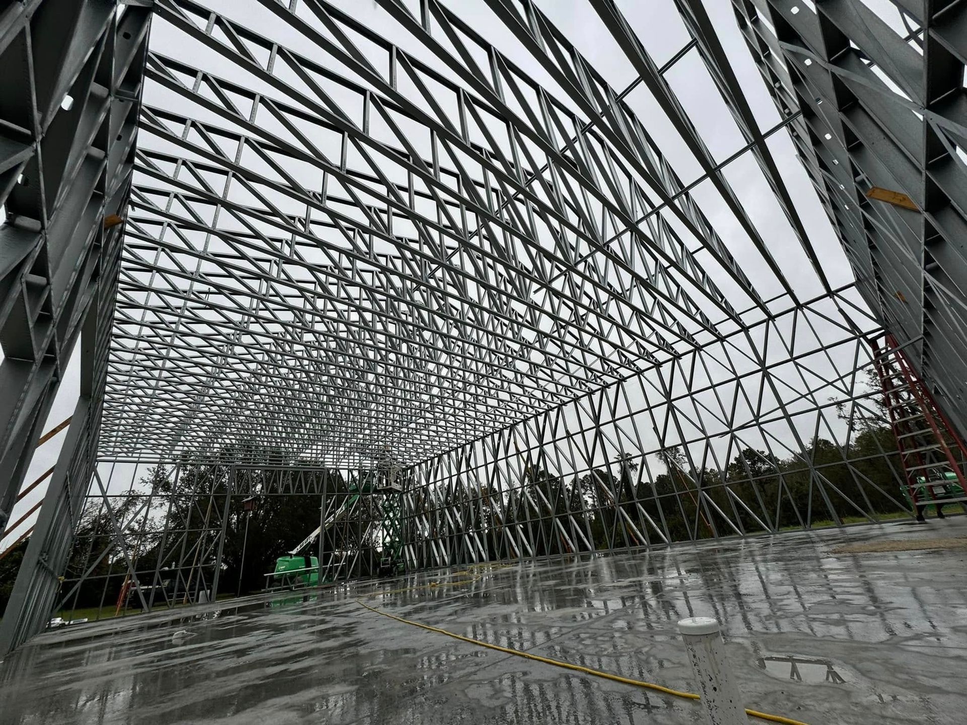 Steel beams forming the framework of a large building under construction.