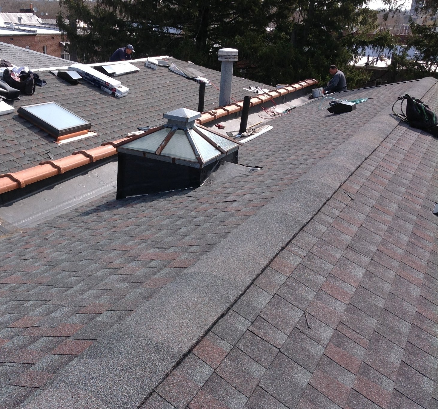 A roof with a skylight on top of it
