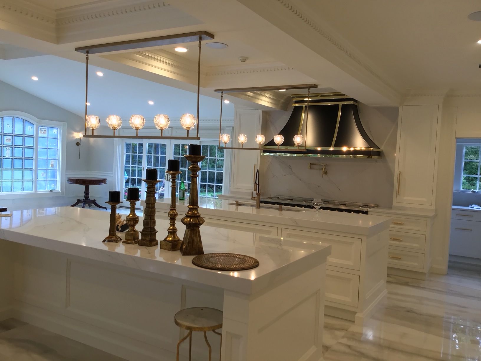 A kitchen with a large island and candles on it