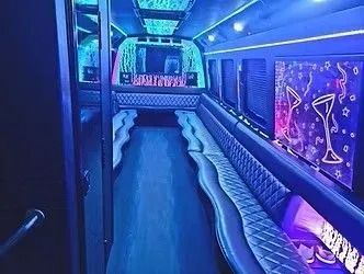 Neon-lit limousine interior with blue seating and purple accent lighting