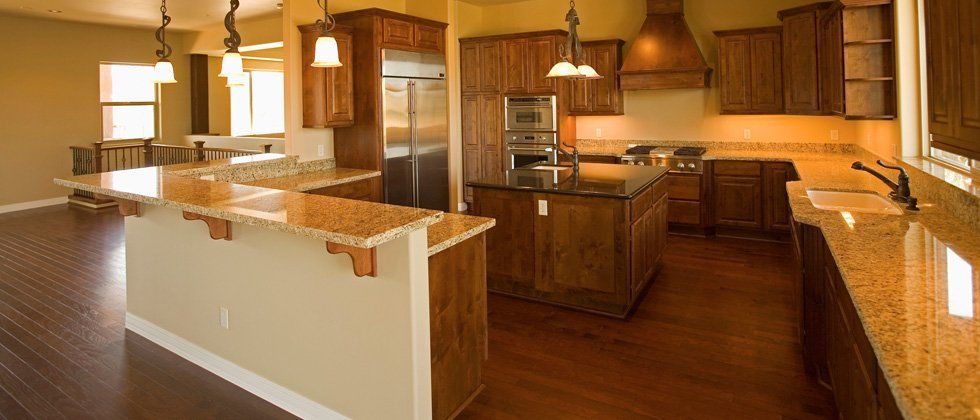 Kitchen with granite counter tops and custom built cabinet