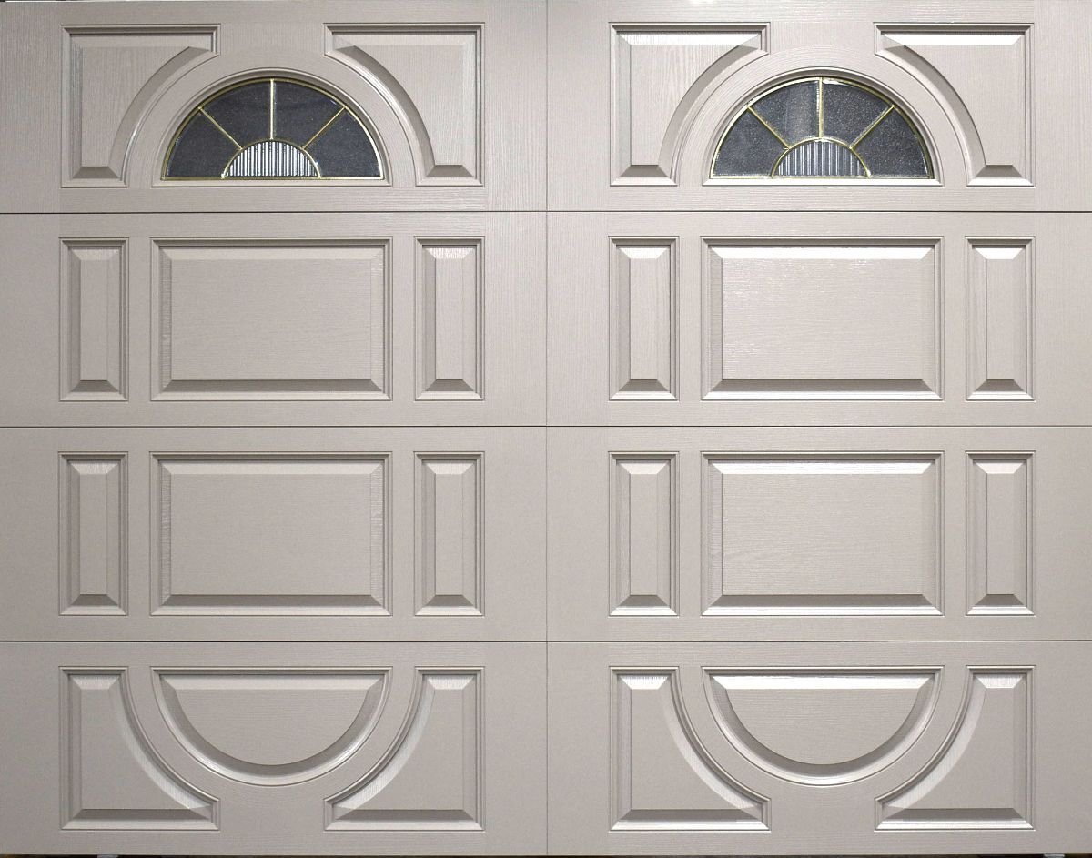 White garage door with decorative panels and arched glass windows.