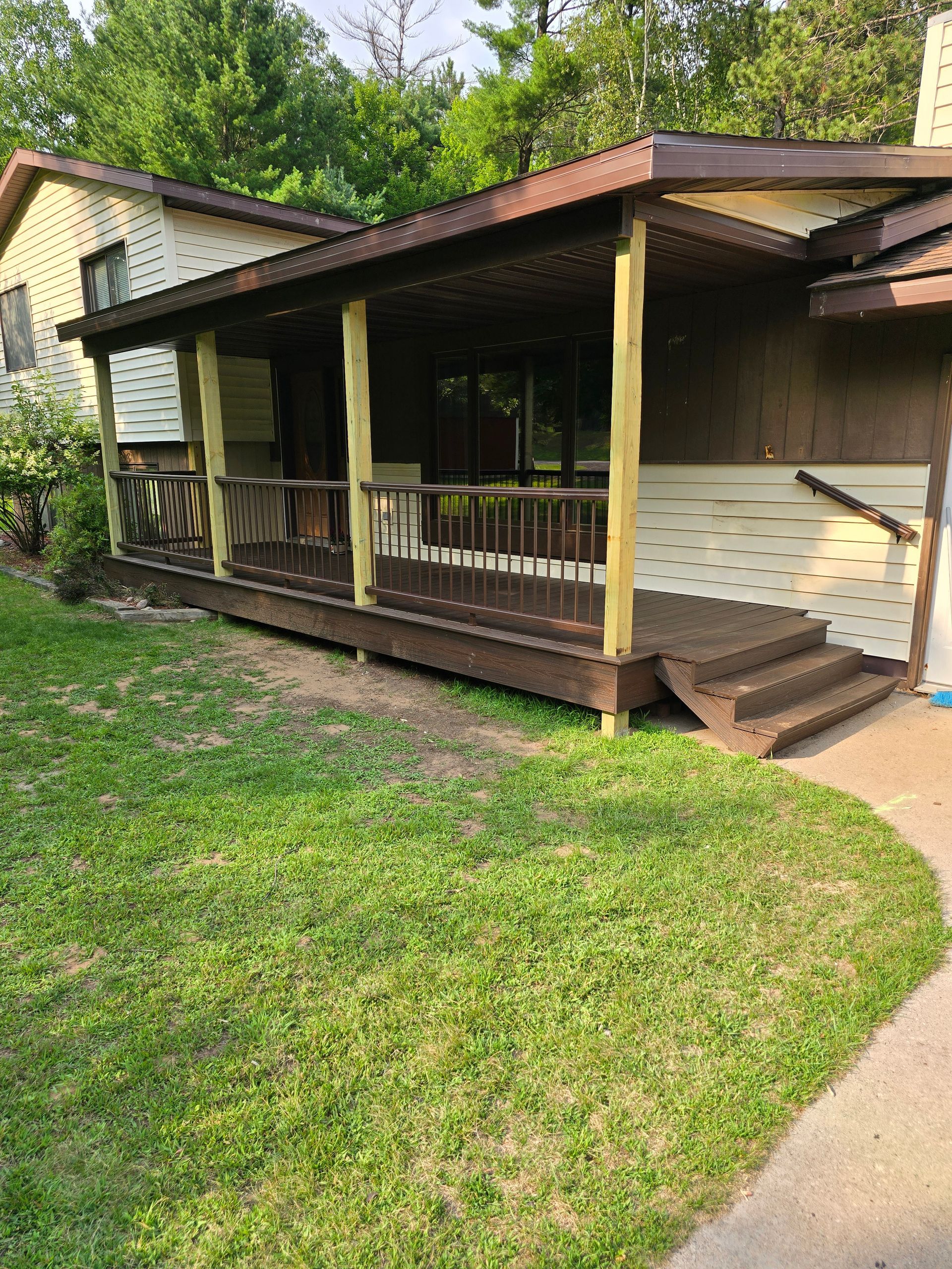 A house with a porch and stairs in front of it