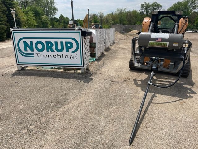 A sign that says Norup Trenching on it