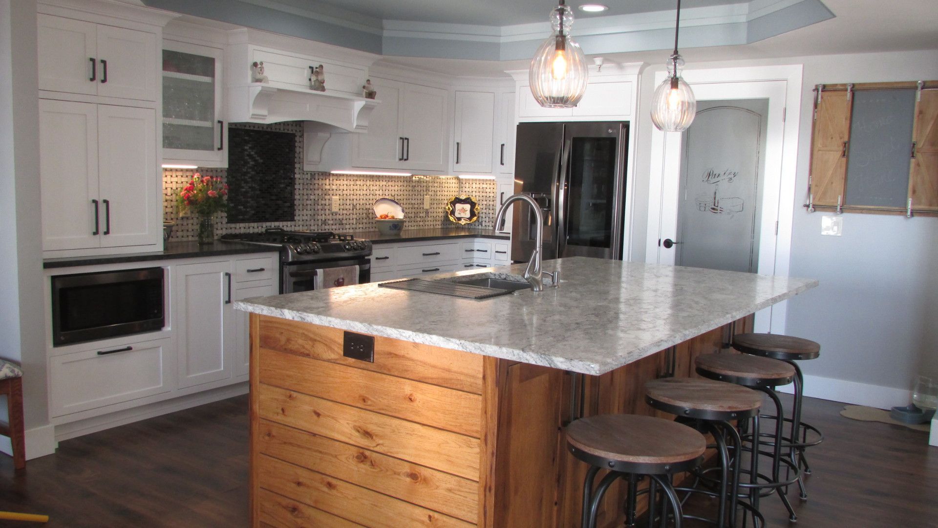 Kitchen in white with rustic hickory shiplap island