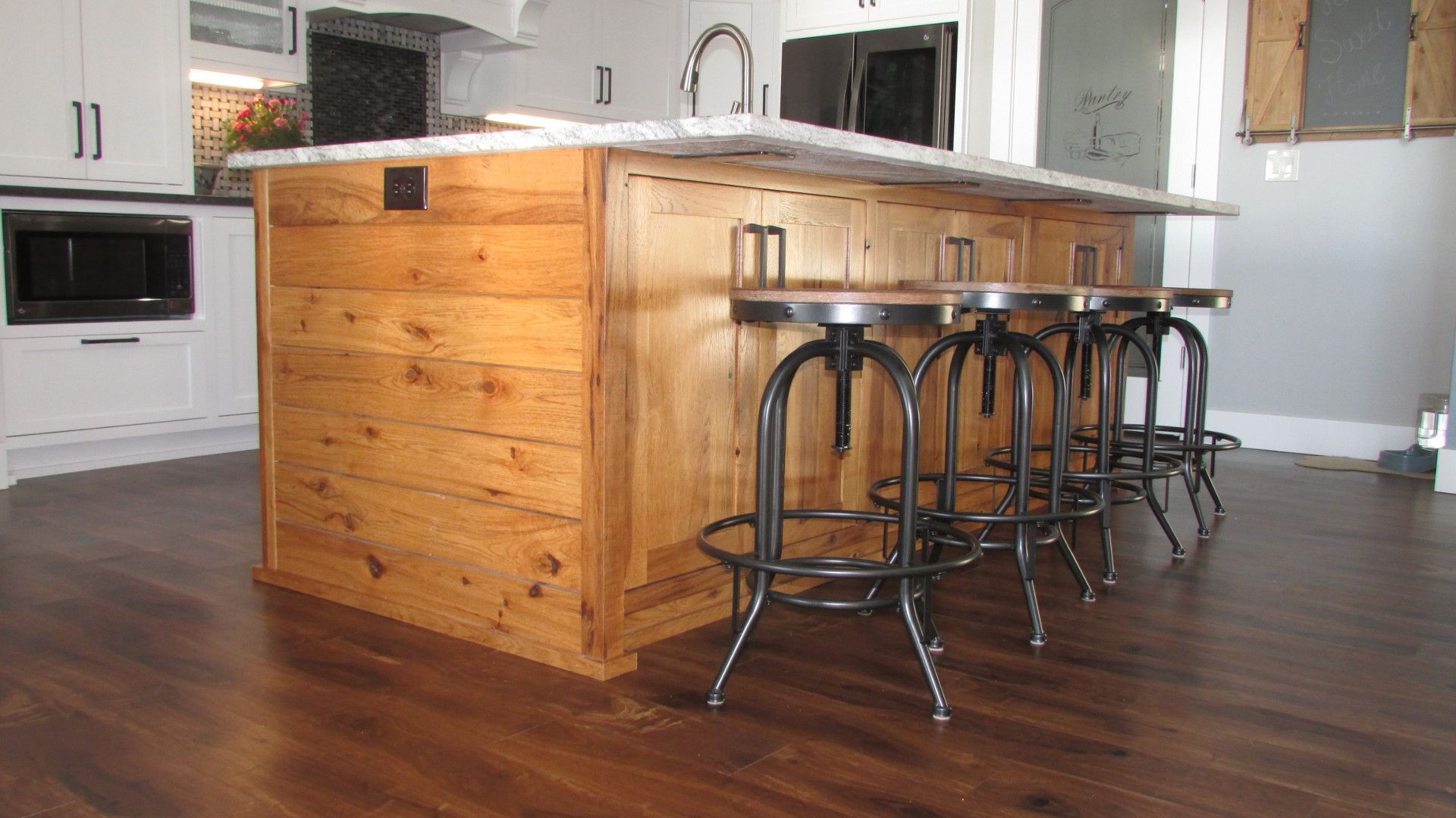 Rustic hickory shiplap sink island with seating