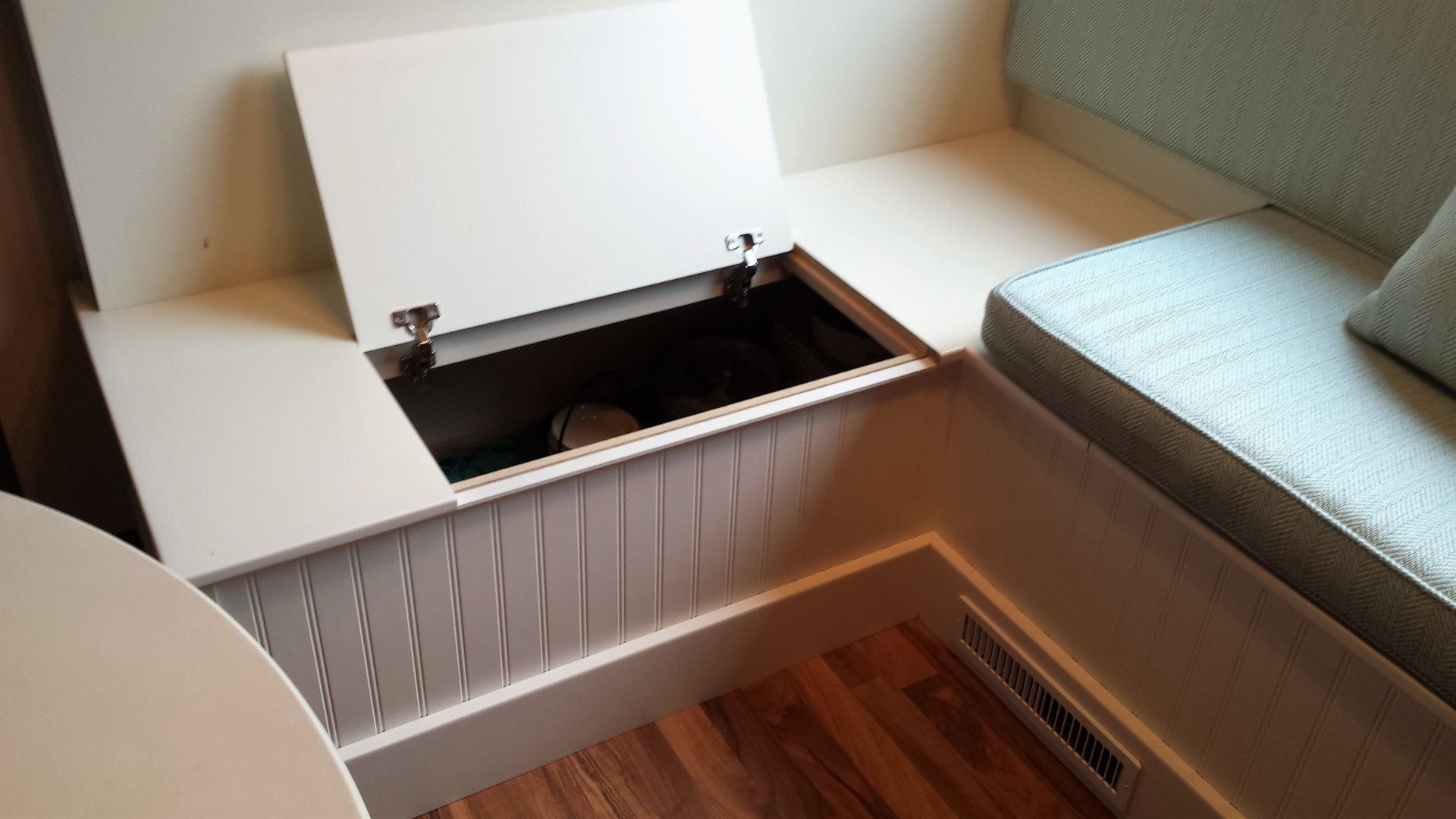 Under seat storage on custom bench