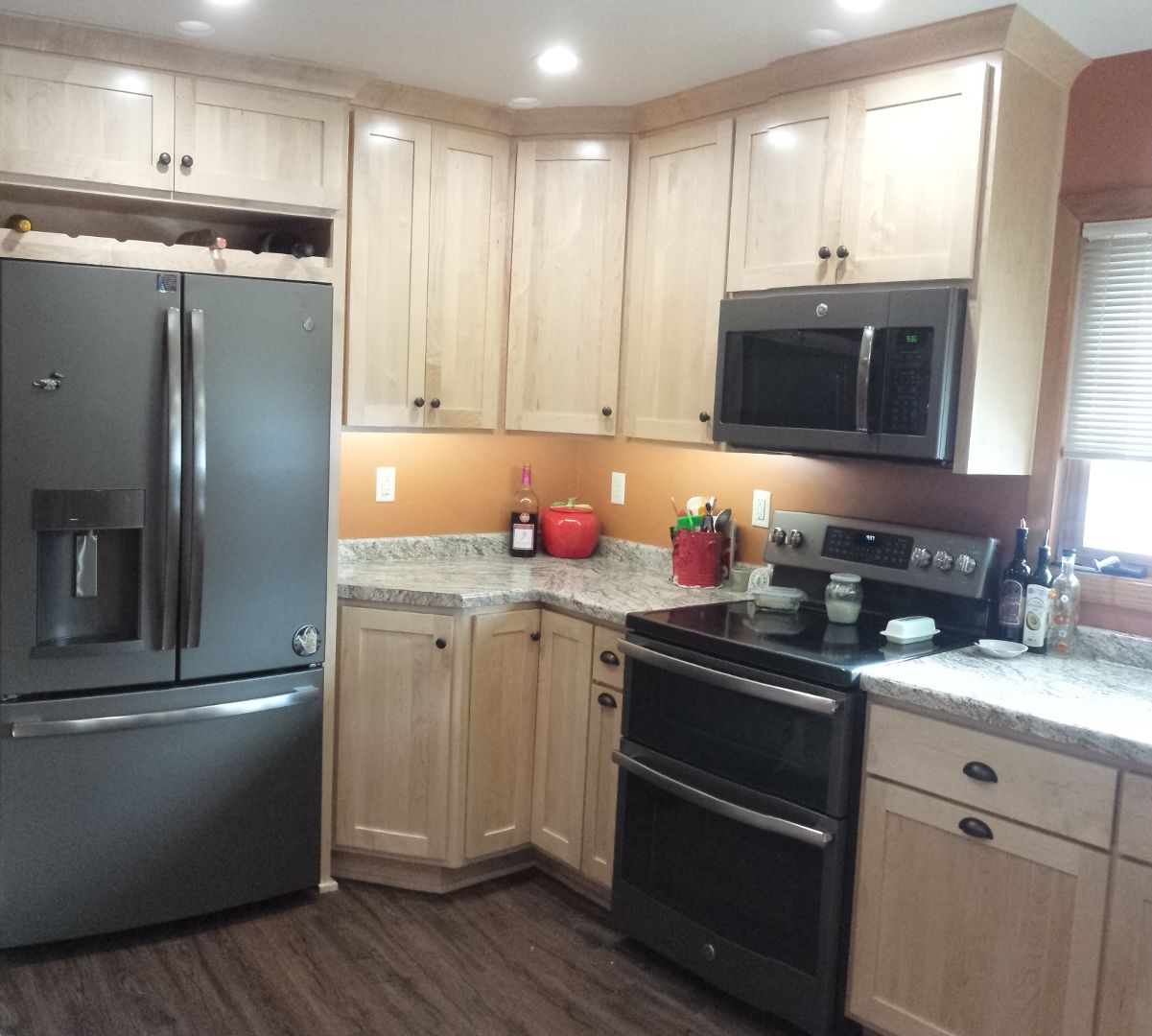 Natural maple reversed flat panel shaker style kitchen