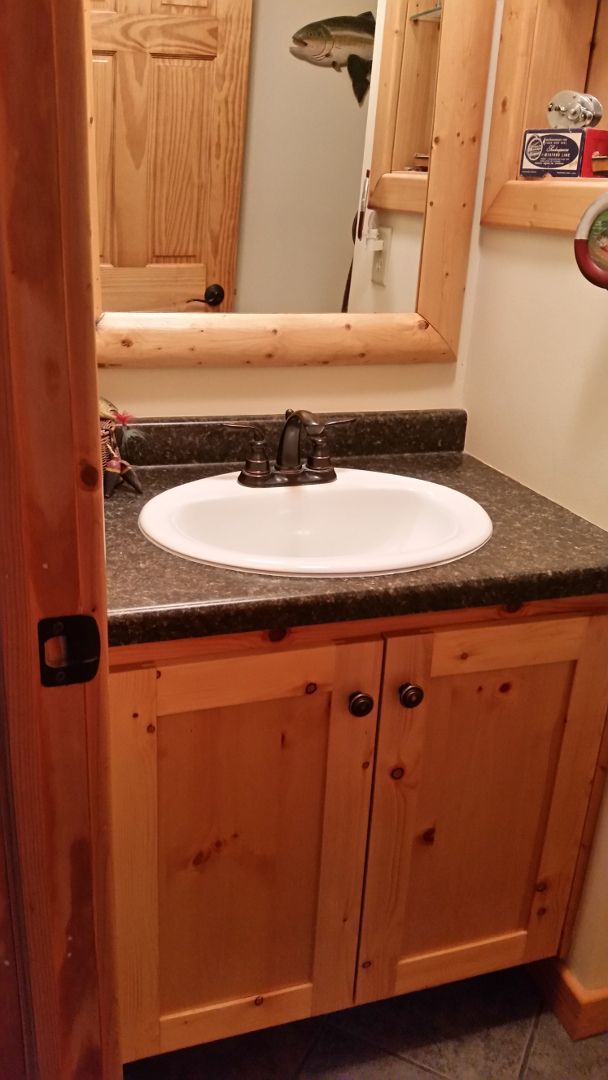Knotty pine small bathroom vanity and mirror