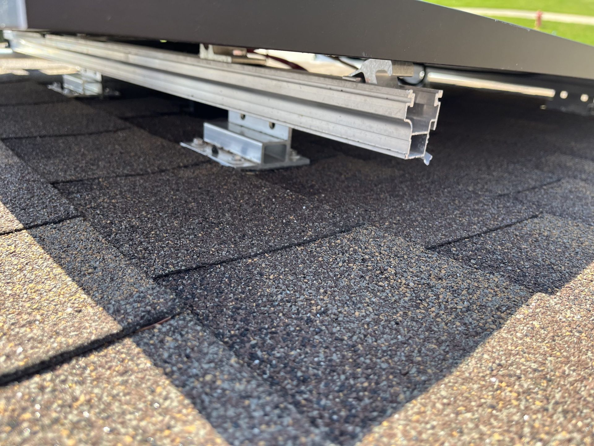 A solar panel is sitting on top of a roof.