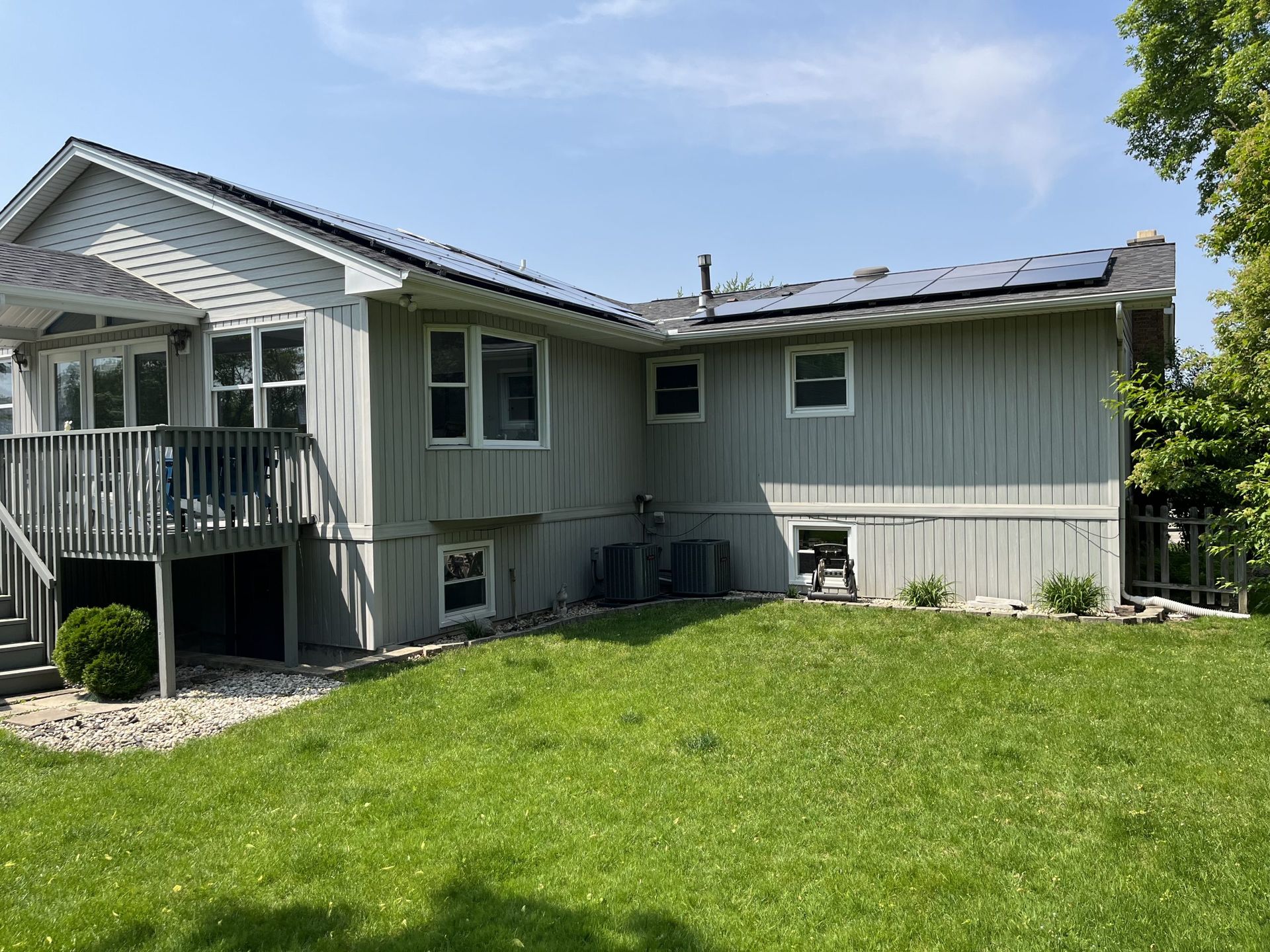 A large house with a large lawn in front of it.