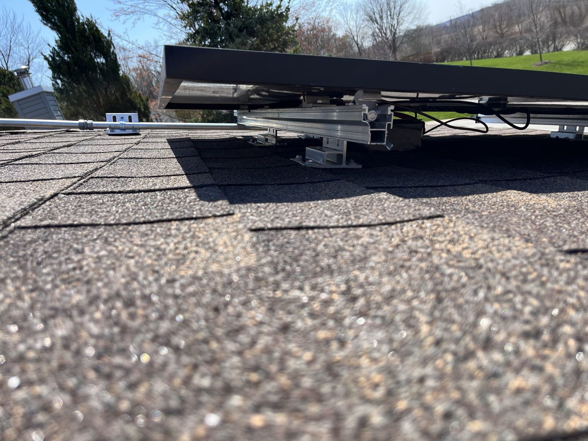 A solar panel is sitting on top of a roof.