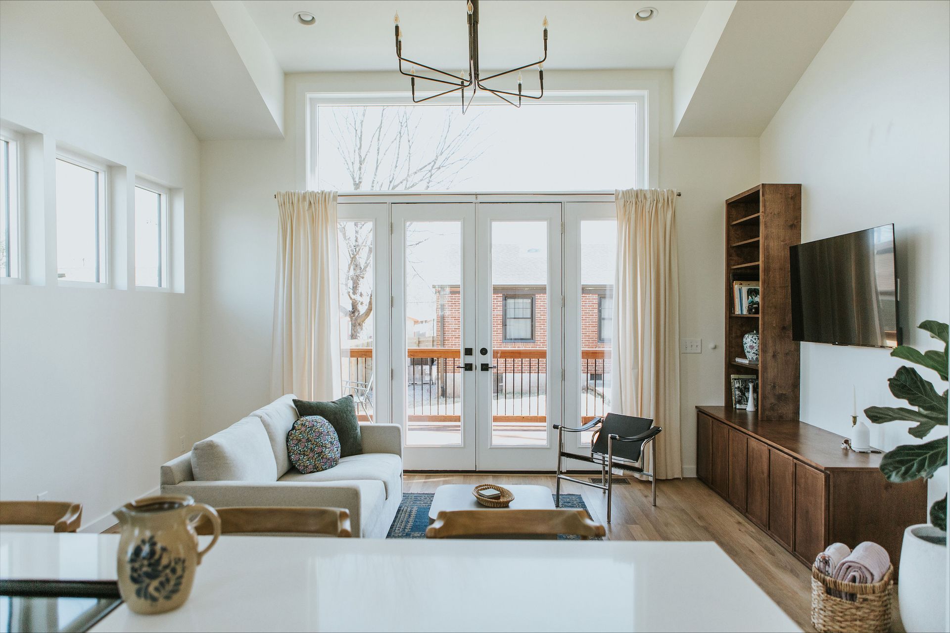 A living room with a couch and a television
