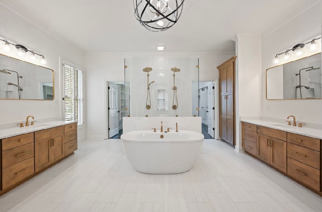 A large bathroom with two sinks and a bathtub.