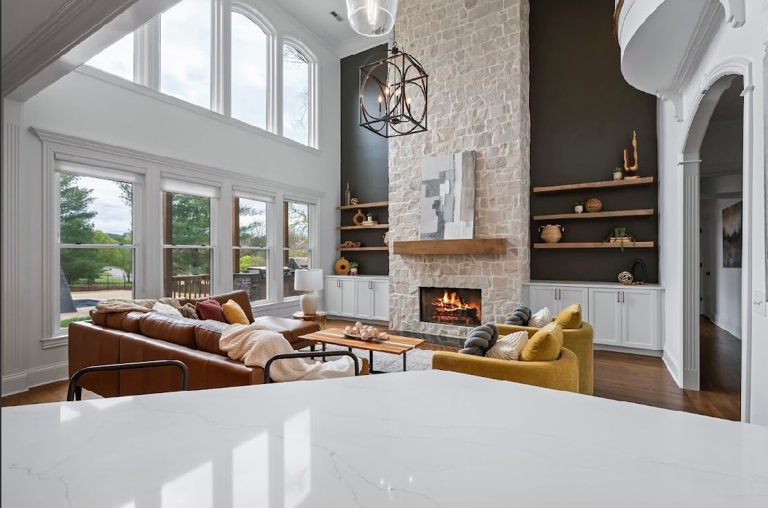 A living room with a fireplace and a couch.