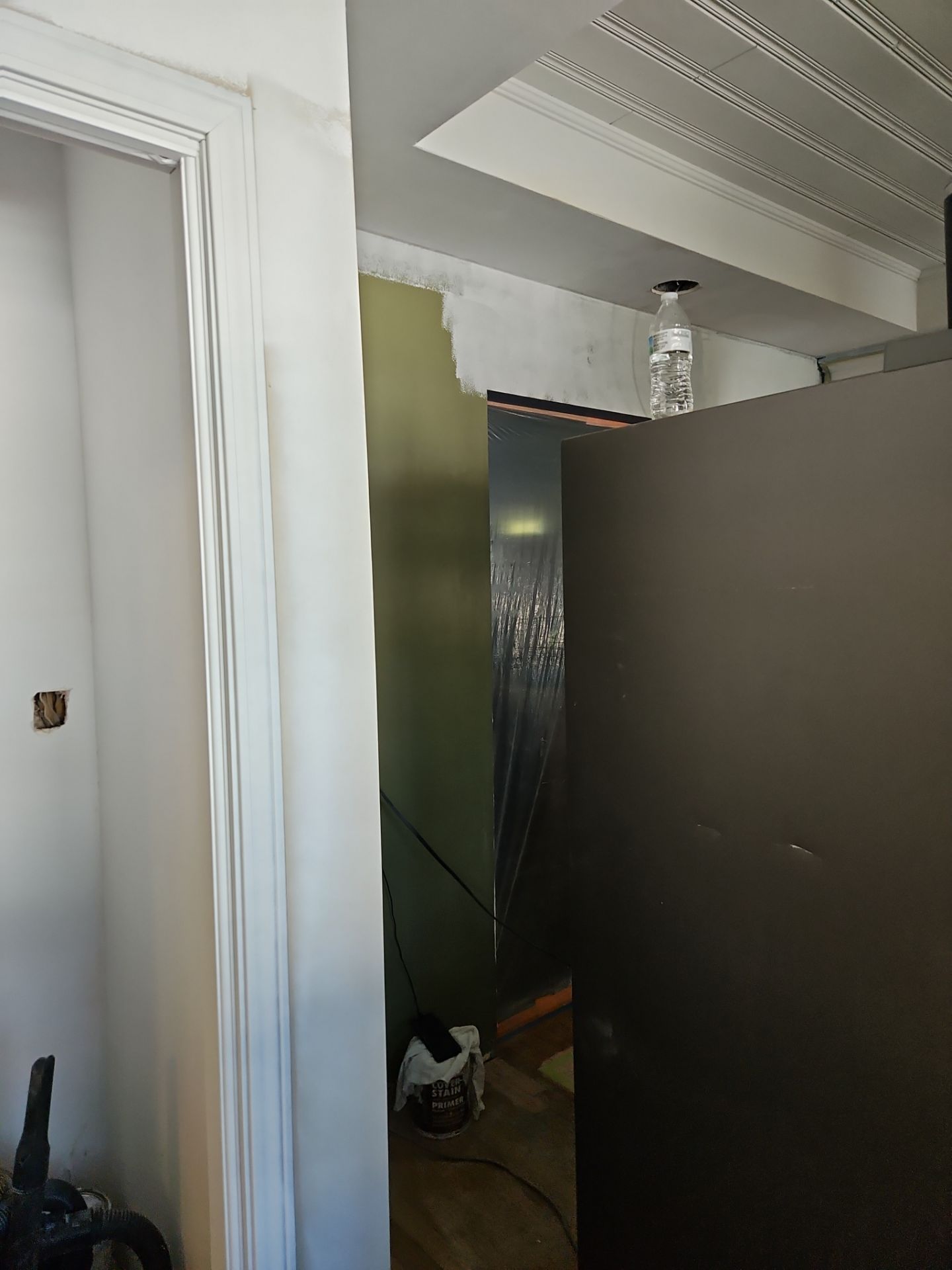 Doorway framing with a wall and unfinished ductwork exposed, interior.