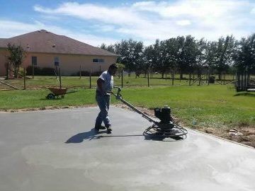 side view of a man at cement work