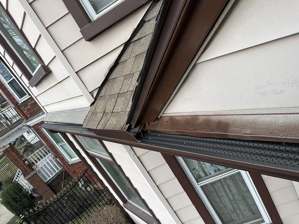 A house with a gutter on the side of it