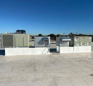 a rooftop with a lot of air conditioning equipment on it