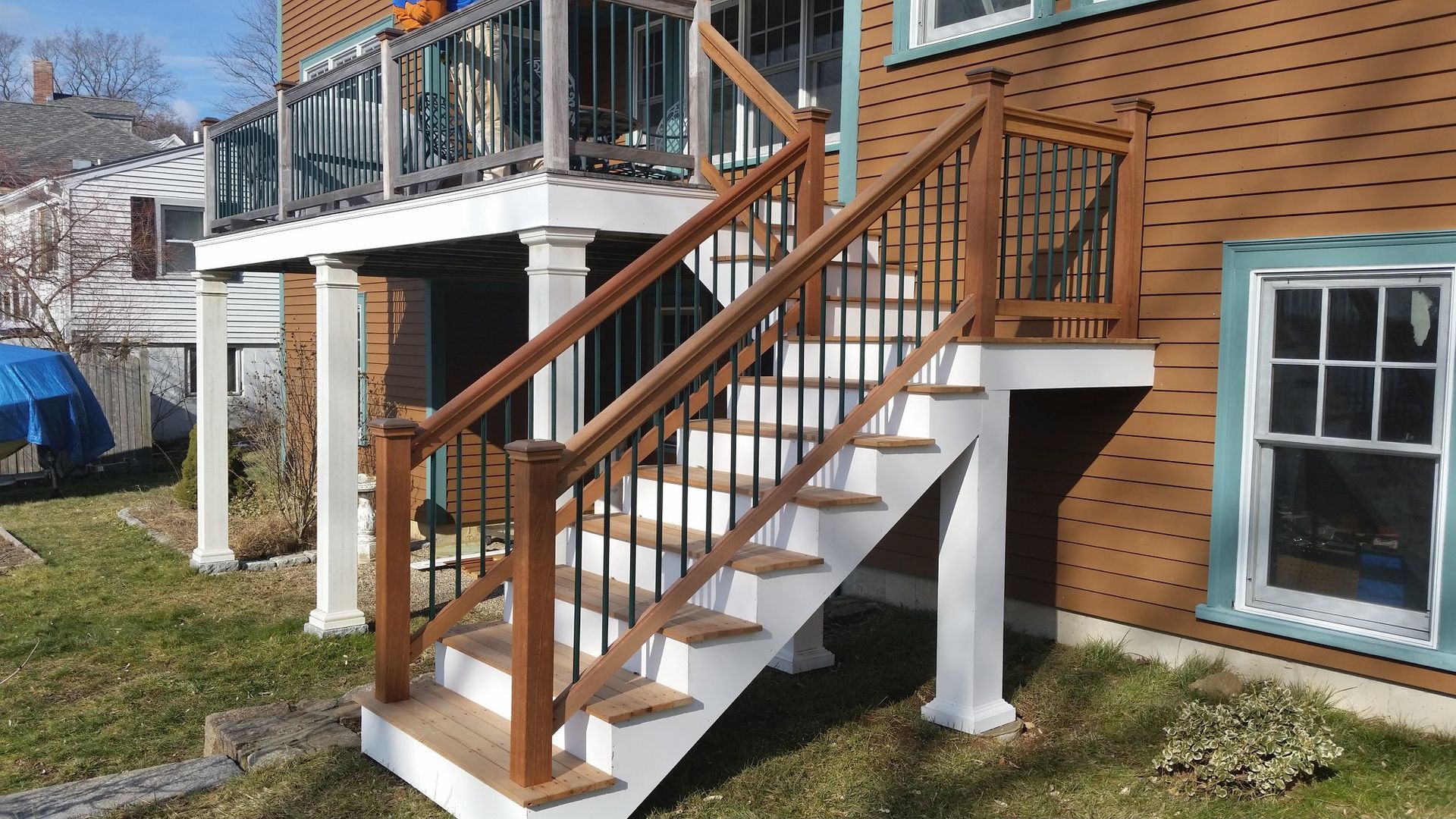 A wooden deck with stairs leading up to it