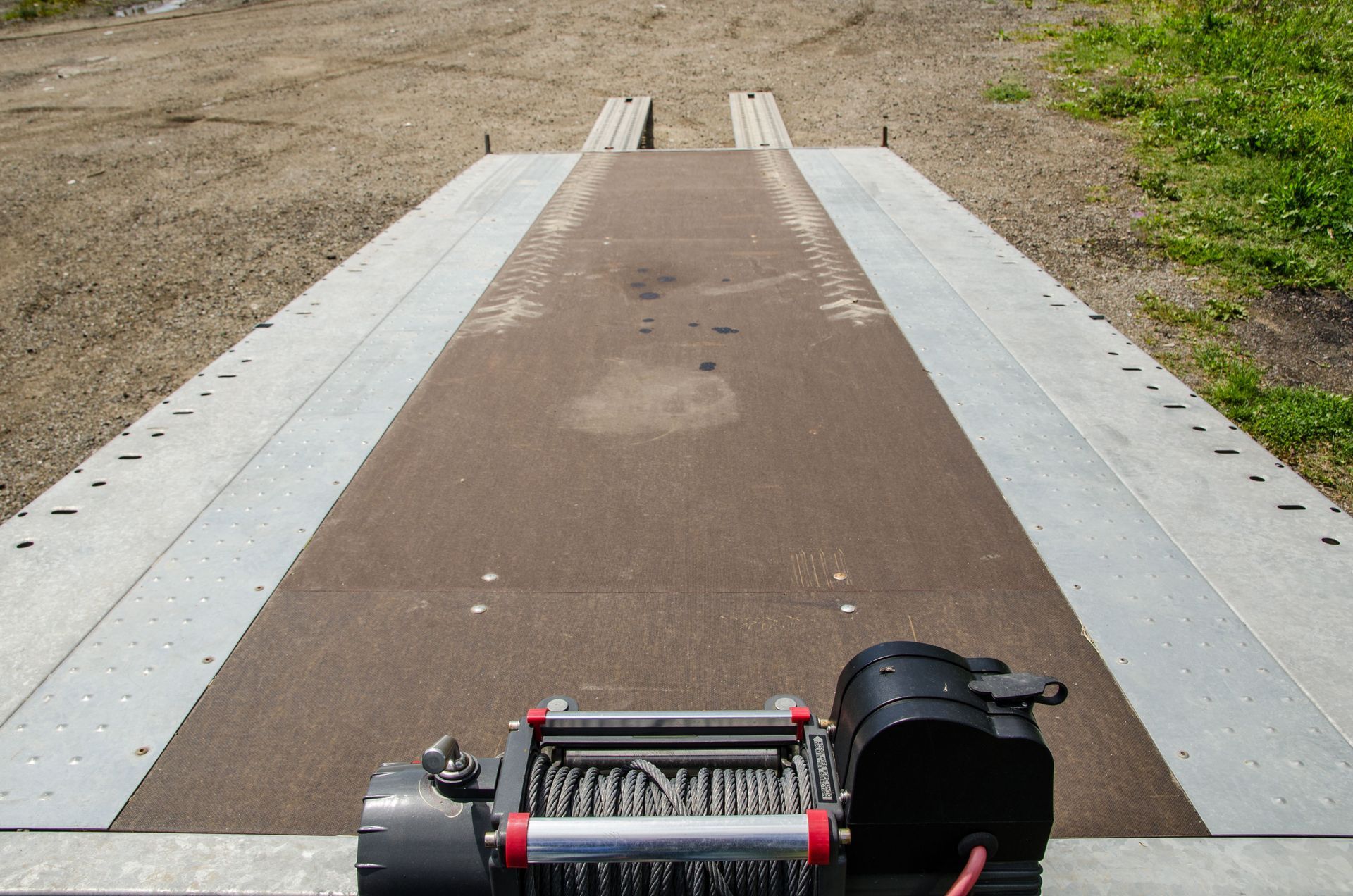 Looking down the back of an empty tow truck.