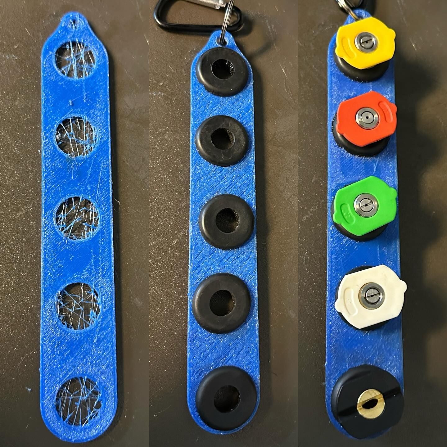 Three blue hanging strips with circular button-like pieces, including black and multicolored ones, on a table.