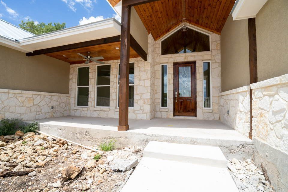 A house with a porch and a wooden door