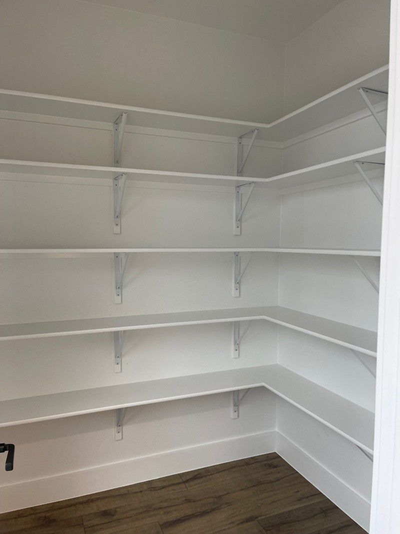 There are a lot of shelves in this room.