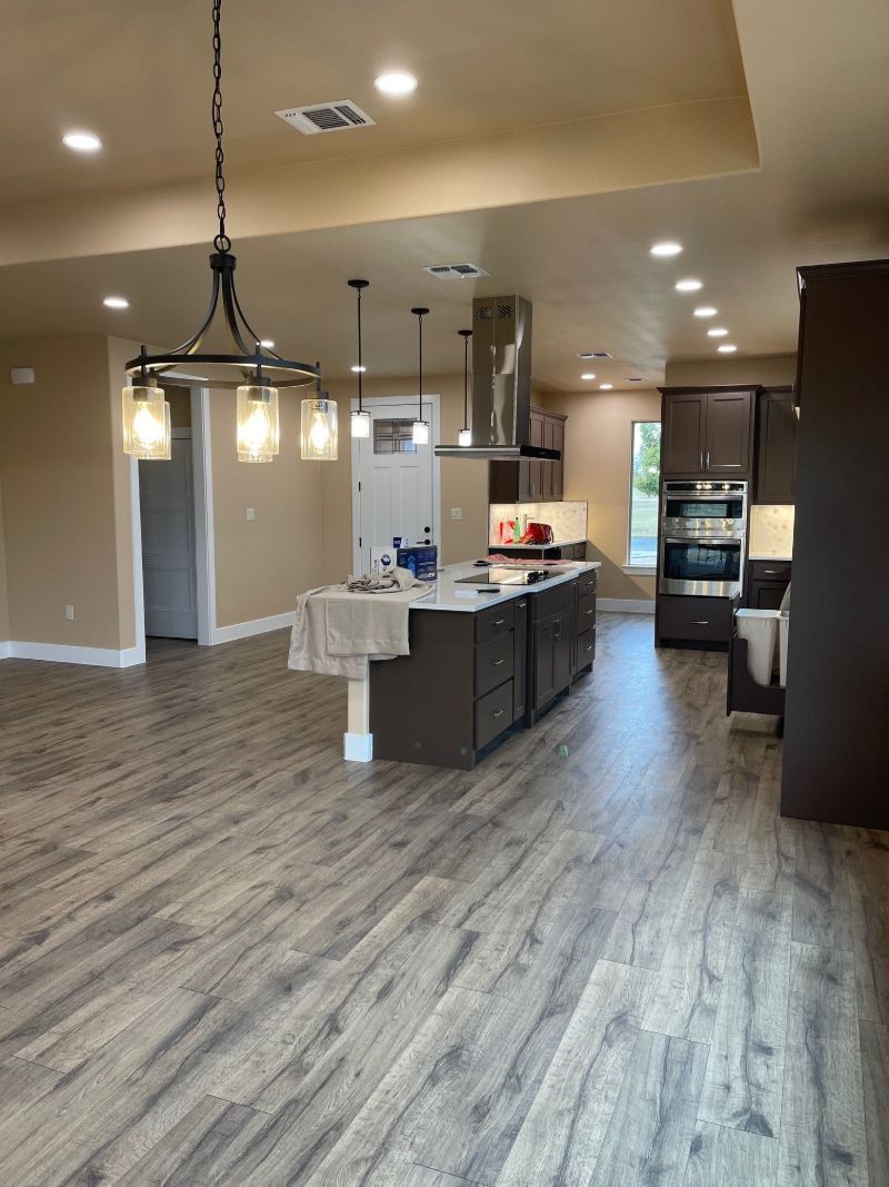 A kitchen with a large island in the middle of the room.