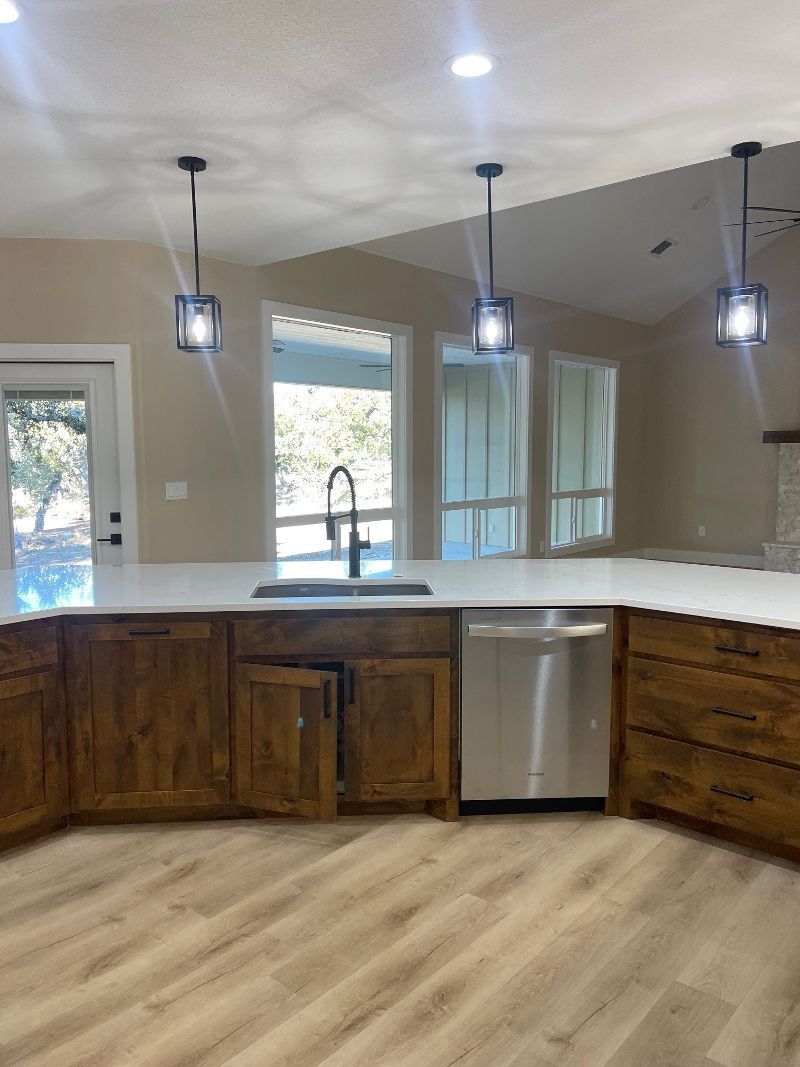 A kitchen with wooden cabinets and stainless steel appliances.