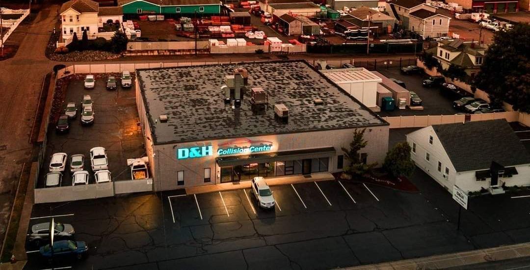 An aerial view of a building with a sign that says d & h